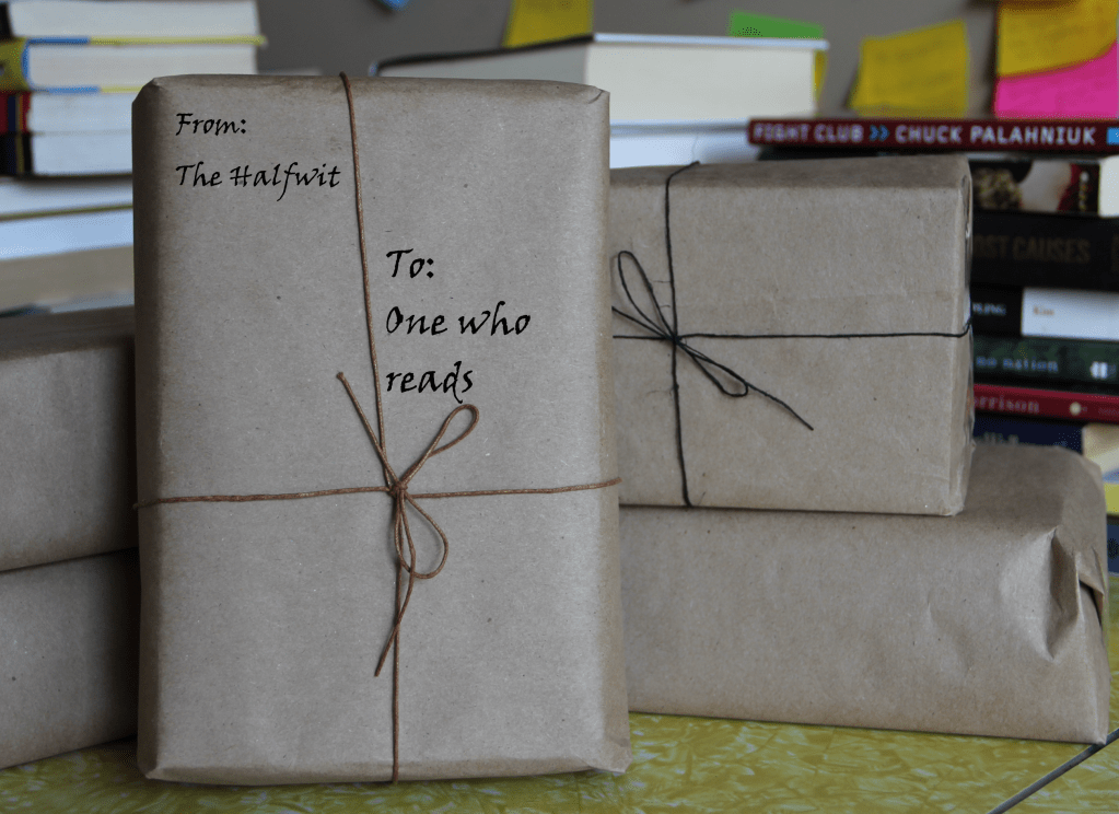 An image of parcels wrapped in kraft brown paper tied with brown and black twine.